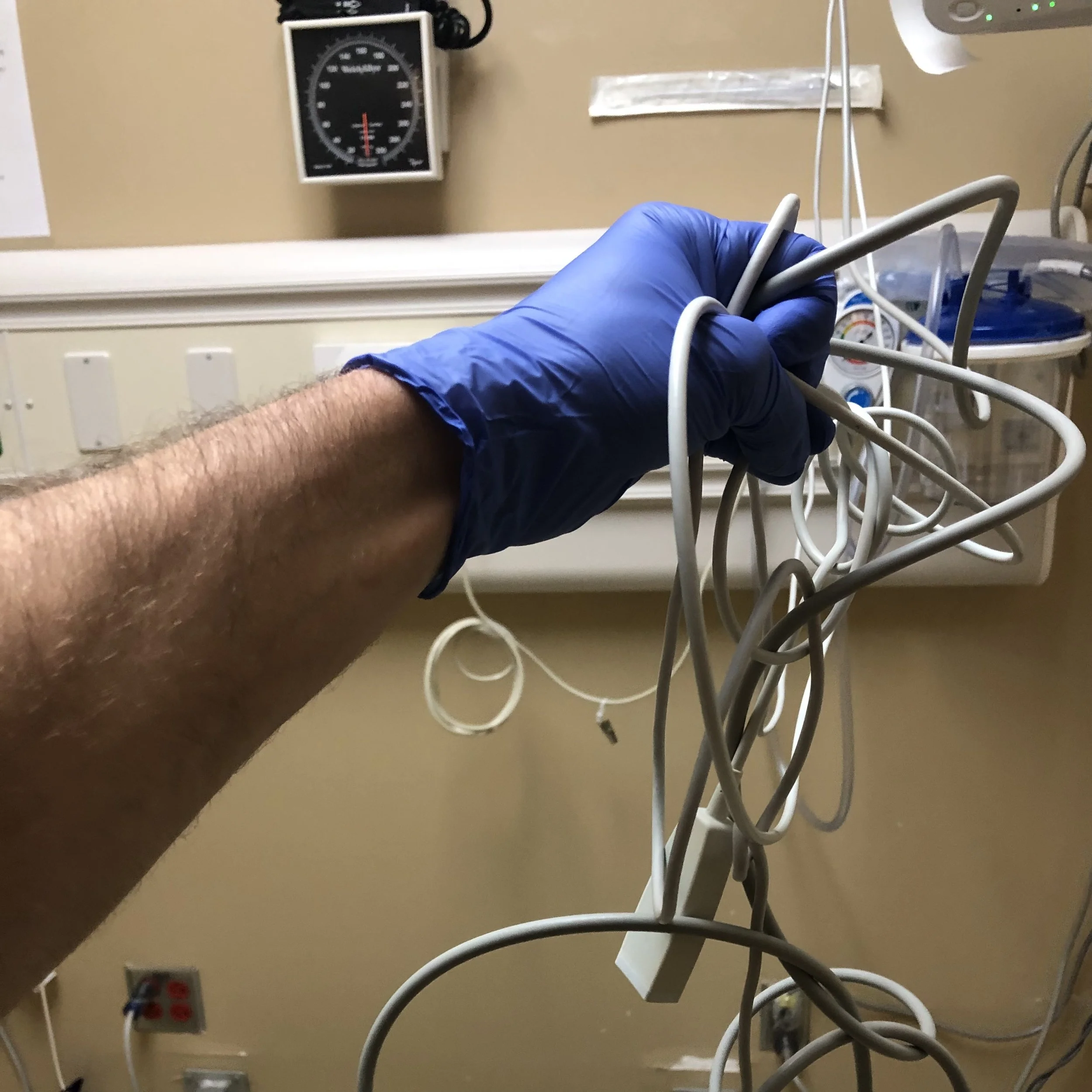 Tangled medical cables demonstrating poor cable management